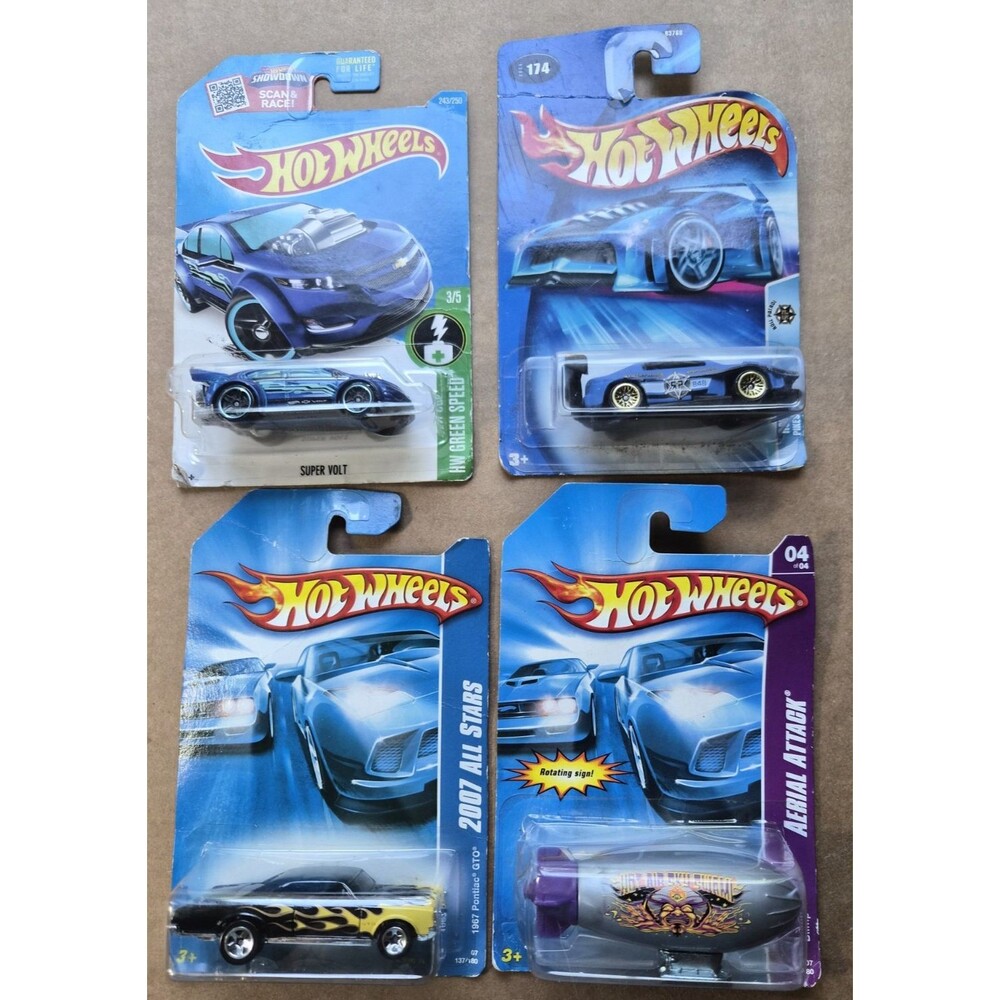 Hot Wheels Lot of 4 Diecast Cars Blimp Super Volt 67 GTO Pikes Peak Celica NIP